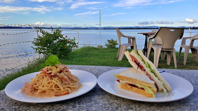 Sandwich and Carbonara of Cafe Lucia with Cancabato Bay and San Jose (DZR Airport Area) in the background
