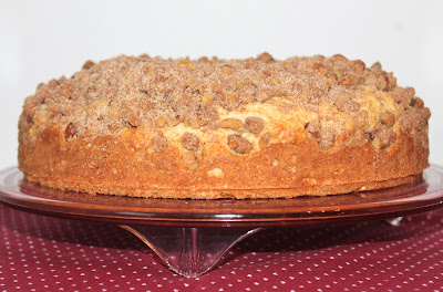 Side view of a quick coffee cake on a cake stand.