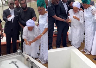 Sammie Okposo’s Wife Ozioma Weeps Endlessly and Inconsolable As She Pours Sand into His Grave at His Funeral - Happenings In 9ja