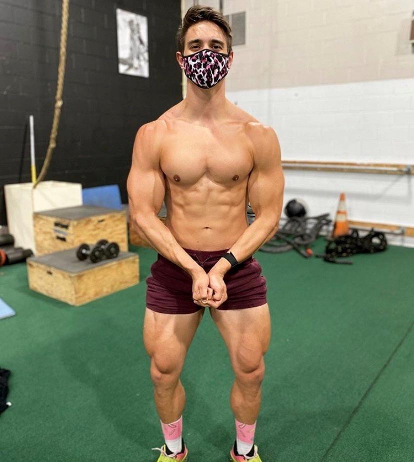 hot-fit-shirtless-guy-flexing-arms-huge-thighs-face-mask