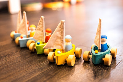 Wooden child toys in a row