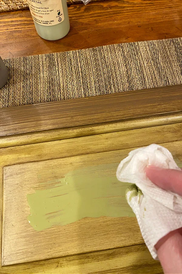 Adding green stain onto cabinet door