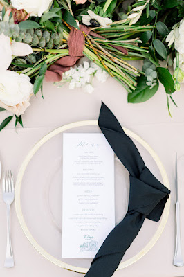 wedding menu with knot napkin fold