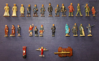 Bazaar Figures; Blue Box; Britains Lilliput; Comet Authenticast; Cowboy Whistle; Dinky; Dublo-Dinky; Flak Gun; Game Playing Pieces; Gaming Figurines; Gun; Hansel & Gretel; Herpat in Steinach; Hornby-Dublo; Injecta Plastic; Injectaplastic; Kinder Figurines; Lineol; Malleable Mouldings; Mocherettes; Passengers; Petrol Station; Plaho; Plastik und Holz; Pom-Pom; Poultry; Rail Staff; Railway Models; Sikh Infantry; Small Scale World; smallscaleworld.blogspot.com; Tai Sang Toys; VEB; Westair; WHW; Wicked Witch; Wild Birds; Wintershilfswerk; Witches Cat;