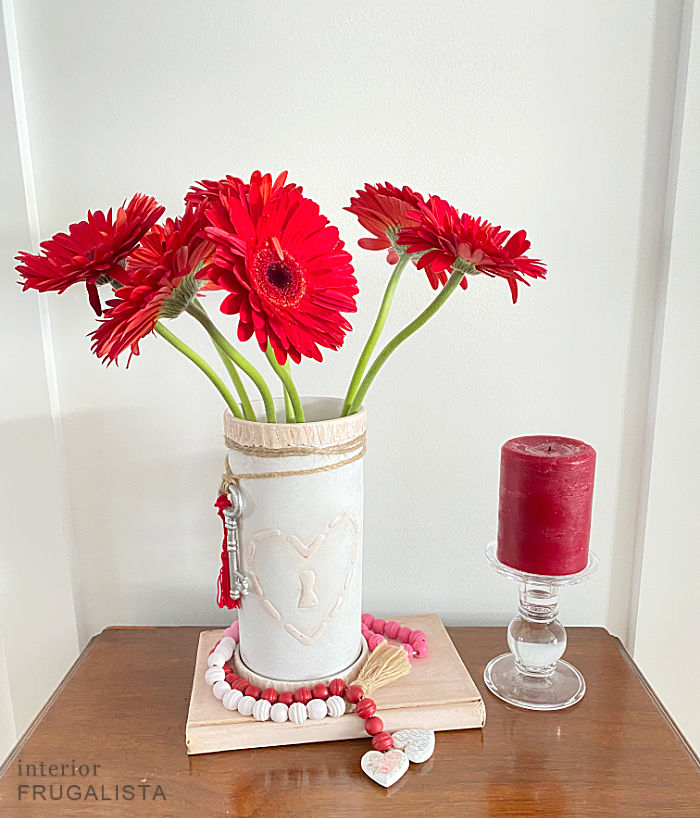 How to turn a vintage terracotta wine cooler from Italy into a romantic hand painted valentine vase with DIY raised stencil lock heart embellishments.