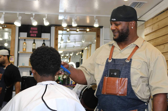 Wayland Baker from the Kings Chair Barber Club on West King in West Augustine.