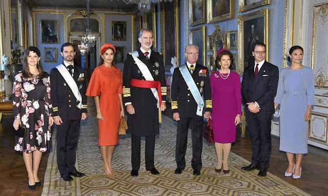 Crown Princess Victoria, Princess Sofia, Queen Silvia. Queen Letizia wore a headband by Cherubina. Carolina Herrera bag. cape
