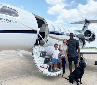 Picture of Meghan Brock with her family with the private jet