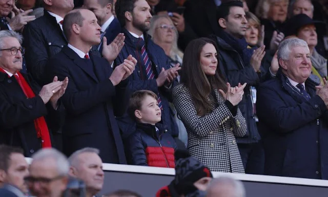 Prince William, Duchess of Cambridge and Prince George. Kate Middleton wore a new knightsbridge houndstooth coat from Holland Cooper