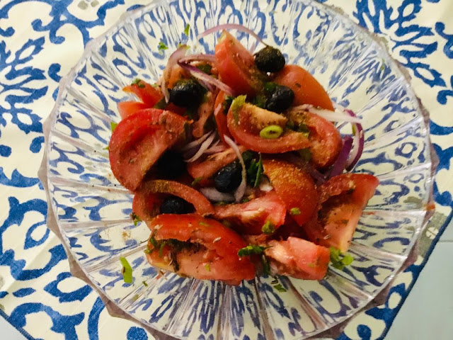 Tomato salad with olives and red onions
