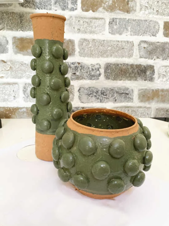 green textured vases with terra cotta rims