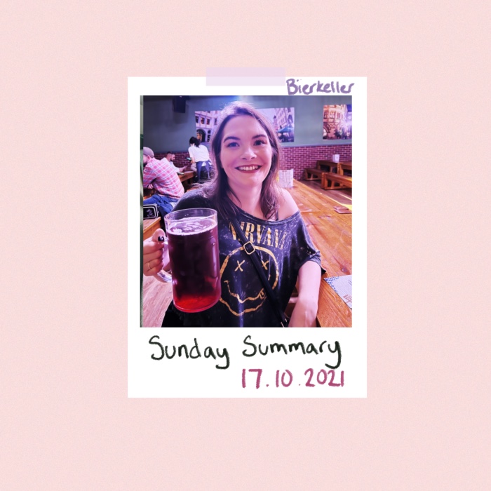 Header image with Polaroid photo on pale pink background. Polaroid has photo of woman sitting in a beer hall holding a large stein of cider. Handwritten text says bierkeller and Sunday summary 17.10.2021