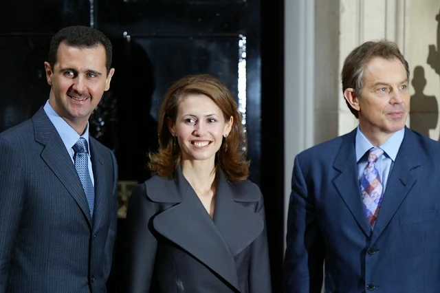 بشار الأسد وزوجته أسماء خلال زيارة إلى بريطانيا ولقائهما برئيس الوزراء آنذاك طوني بلير، في 16 ديسمبر 2002 (أ ف ب)