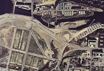 Colour overhead photo of the northeast section of LeBreton Flats where Wellington intersects with the Ottawa River Parkway just west of Bay Street. Circa 1968. We also see the empty blocks between the streets in LeBreton Flats.