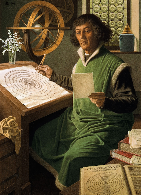 Painting of an older, white, clean-shaven man from the Middle Ages with uncompromising, deeply lined features and a severe expression. His curly hair bunches widely around his chin and he is wearing a soft, green, shin-length robe trimmed with white fur over a dark brown, long-sleeved shirt. He is seated at a slanted drawing table, using calipers on a large, hand-drawn heliocentric system of the planets labelled in Latin while gazing at a much smaller piece of paper in his other hand. On the desk is a small, clear glass filled with water and cut stems of small, white flowers (lily-of-the-valley), and in the background is a large, free-standing astrolabe and some other circular device with hands mounted on the wall. The room is clean and bright with daylight, and cluttered with many books and papers, including one of the Ptolemaic solar system model laid conspicuously close to the viewer.