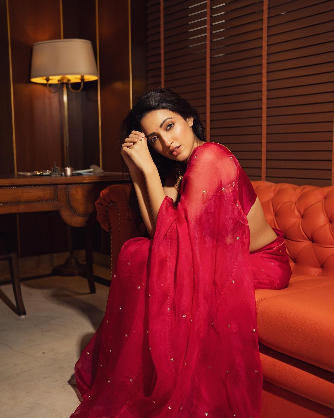 Neha Shetty Dazzles in a Transparent Red Saree and Reaches a Million Followers on Instagram
