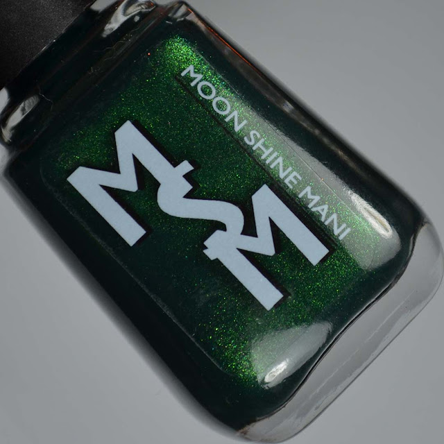 matte green nail polish in a bottle