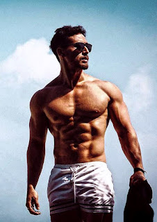 stylish pic of tigershroff upper nude body with goggle