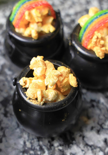 cauldron with gold dusted popcorn.