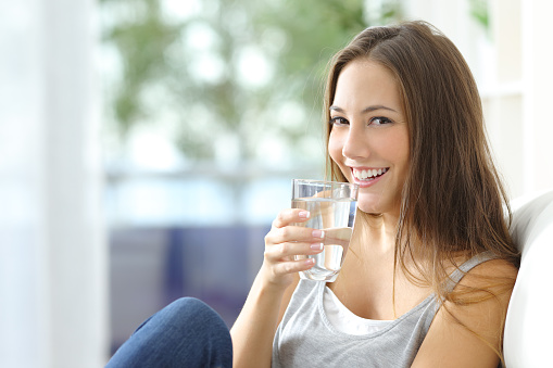 Woman Drink Water to Prevent Migraines
