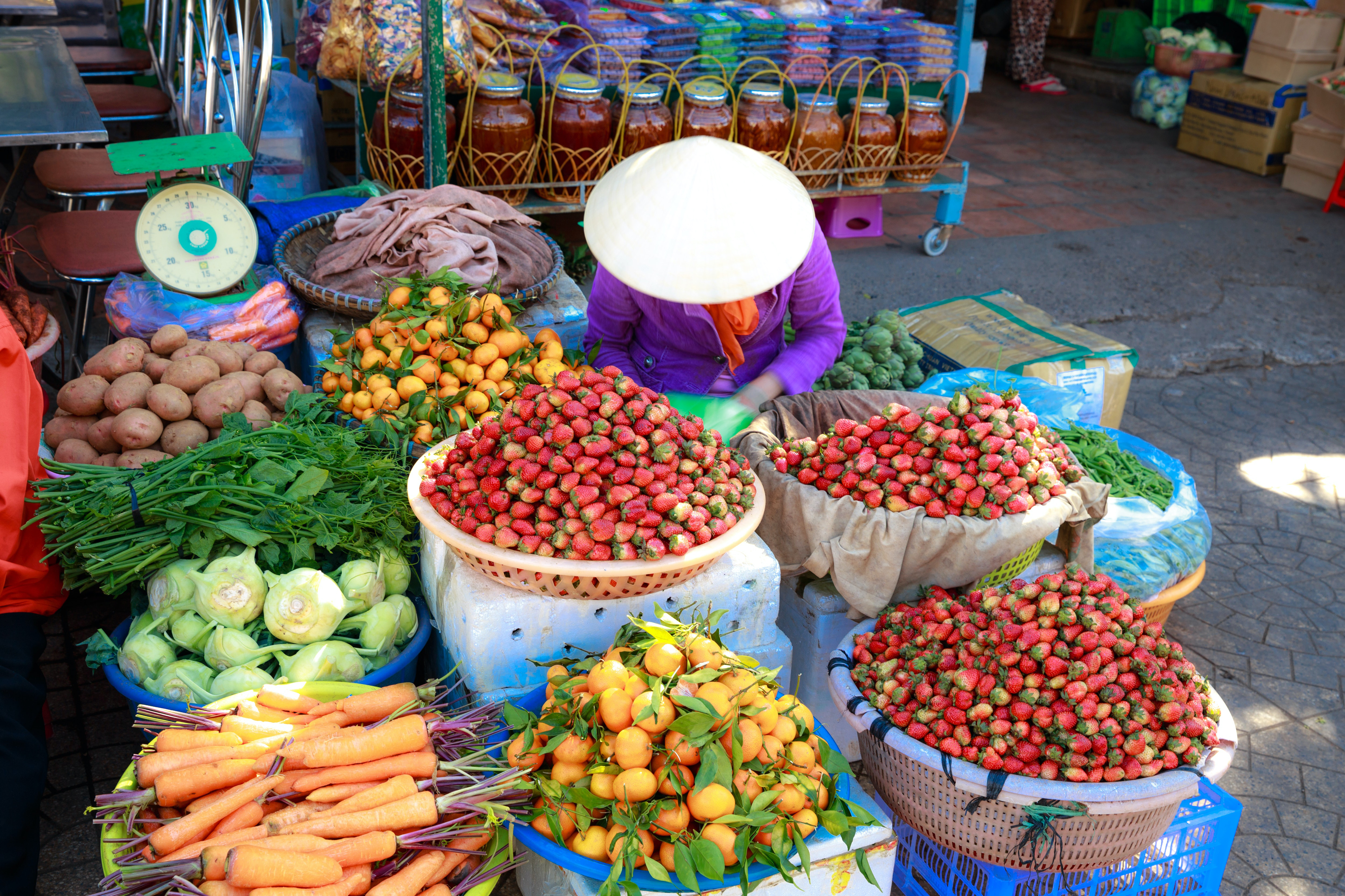 Fruit and vegetable market trader. Photo by Quang Nguyen Vinh from Pexels