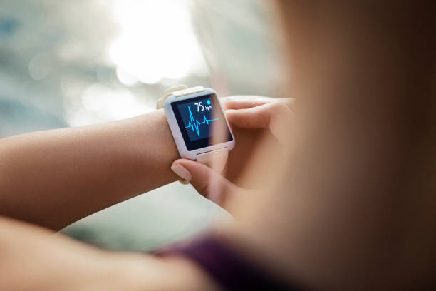 Active woman checking her smartwatch during a workout session