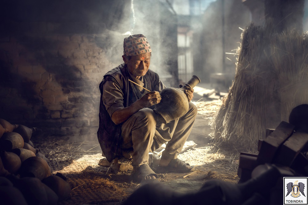 nepali old man making clay pots