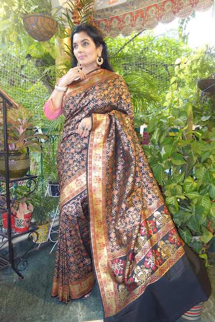 Banarasi silk saree. With Patola like Navratan body and Paithani like border and pallu- black, Blue and silver