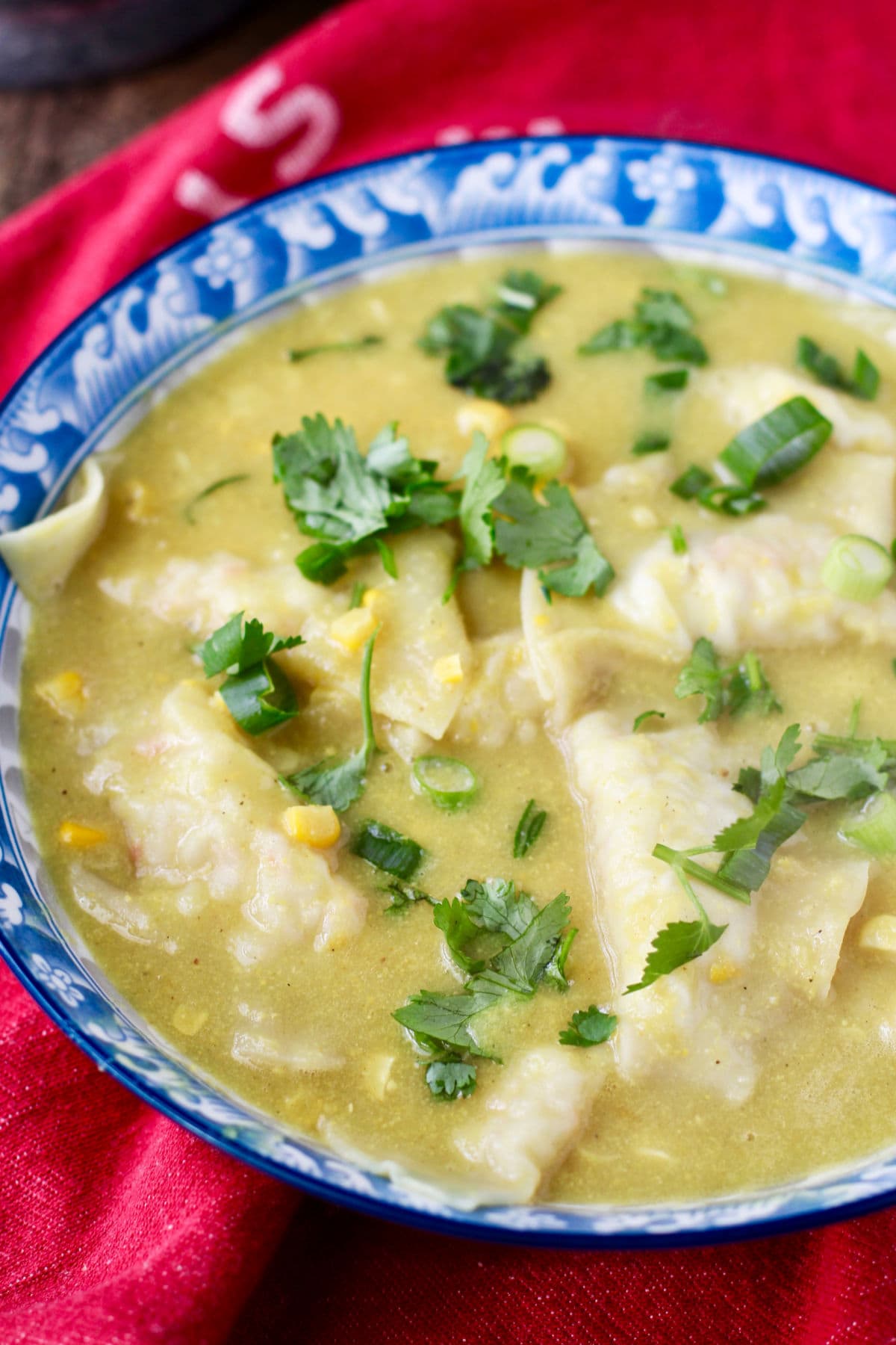 Wonton and Corn Chowder with Cilantro and Scallions in a large bowl.