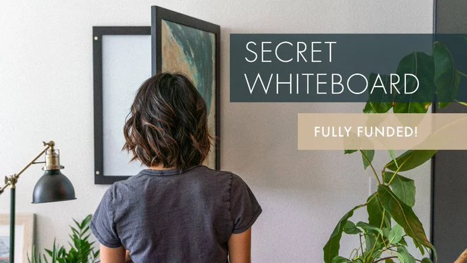 Secret Whiteboard: Flip From Work to Home In One Motion A hanging print frame that opens to reveal a large magnetic whiteboard. Make any space multifunctional.