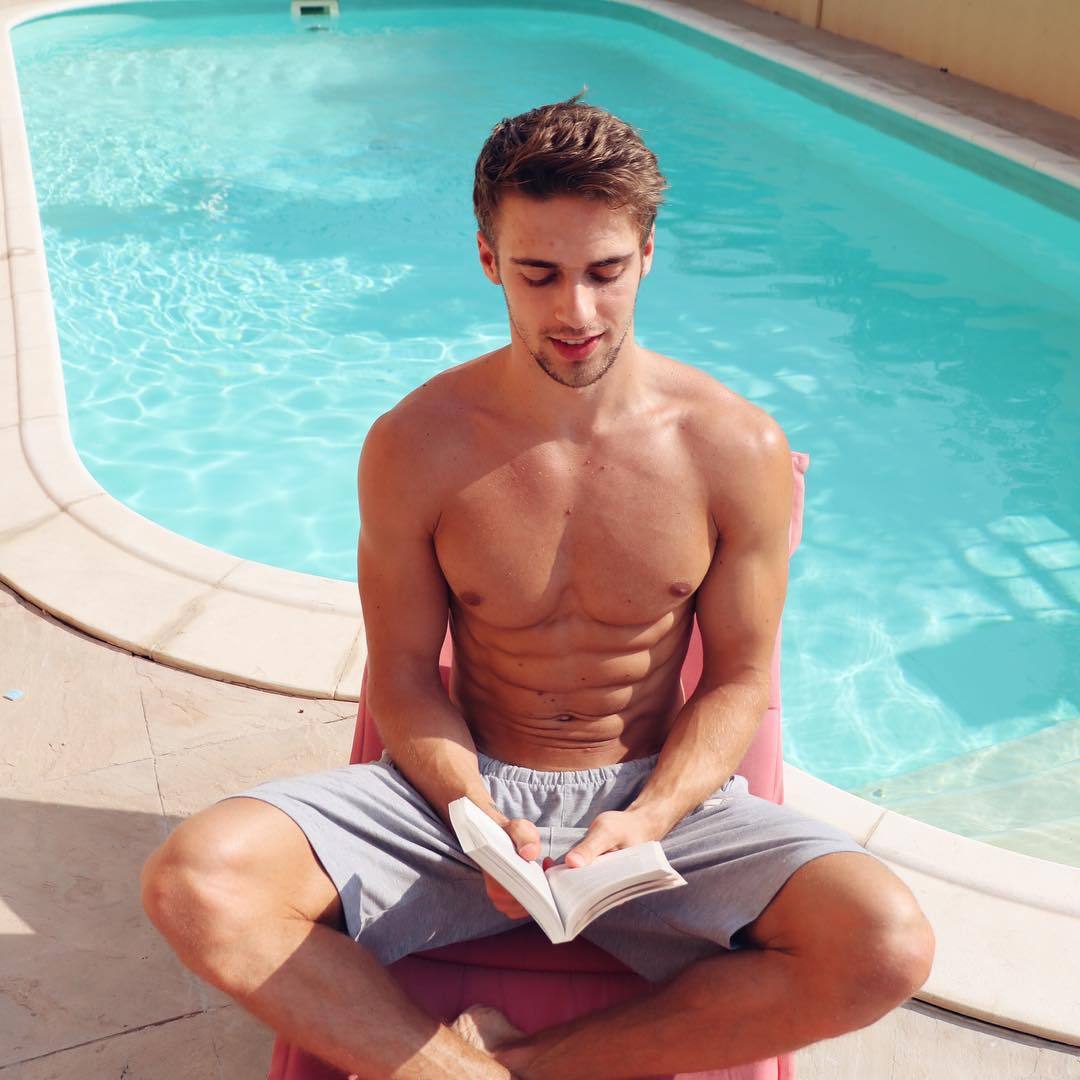 fit-shirtless-hot-guy-reading-pool-