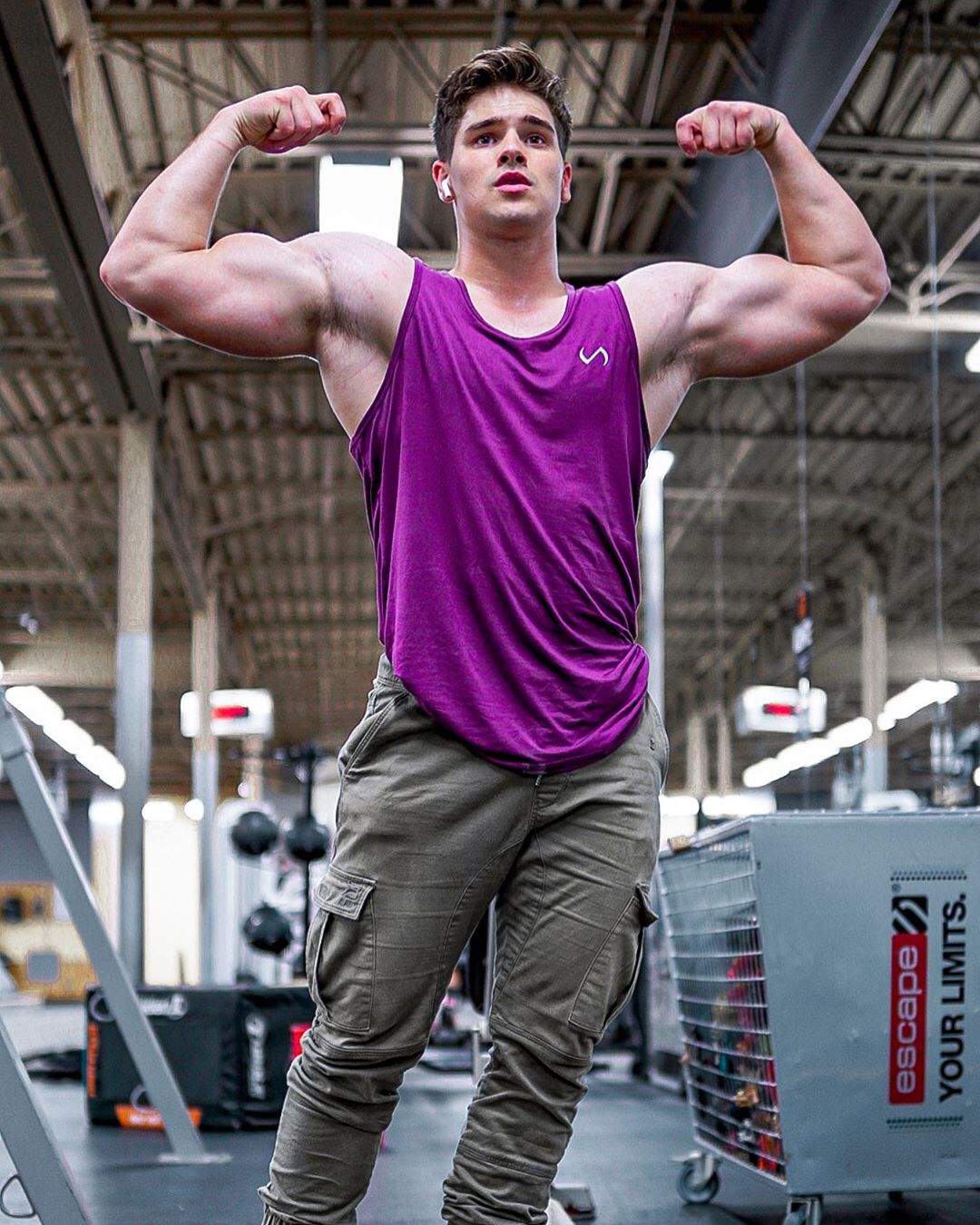 attractive-young-college-gym-guy-huge-biceps-flex