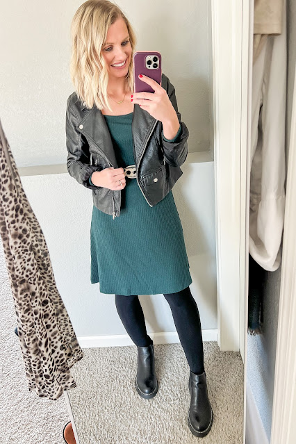 Forest green dress with a black moto jacket, tights and Chelsea boots