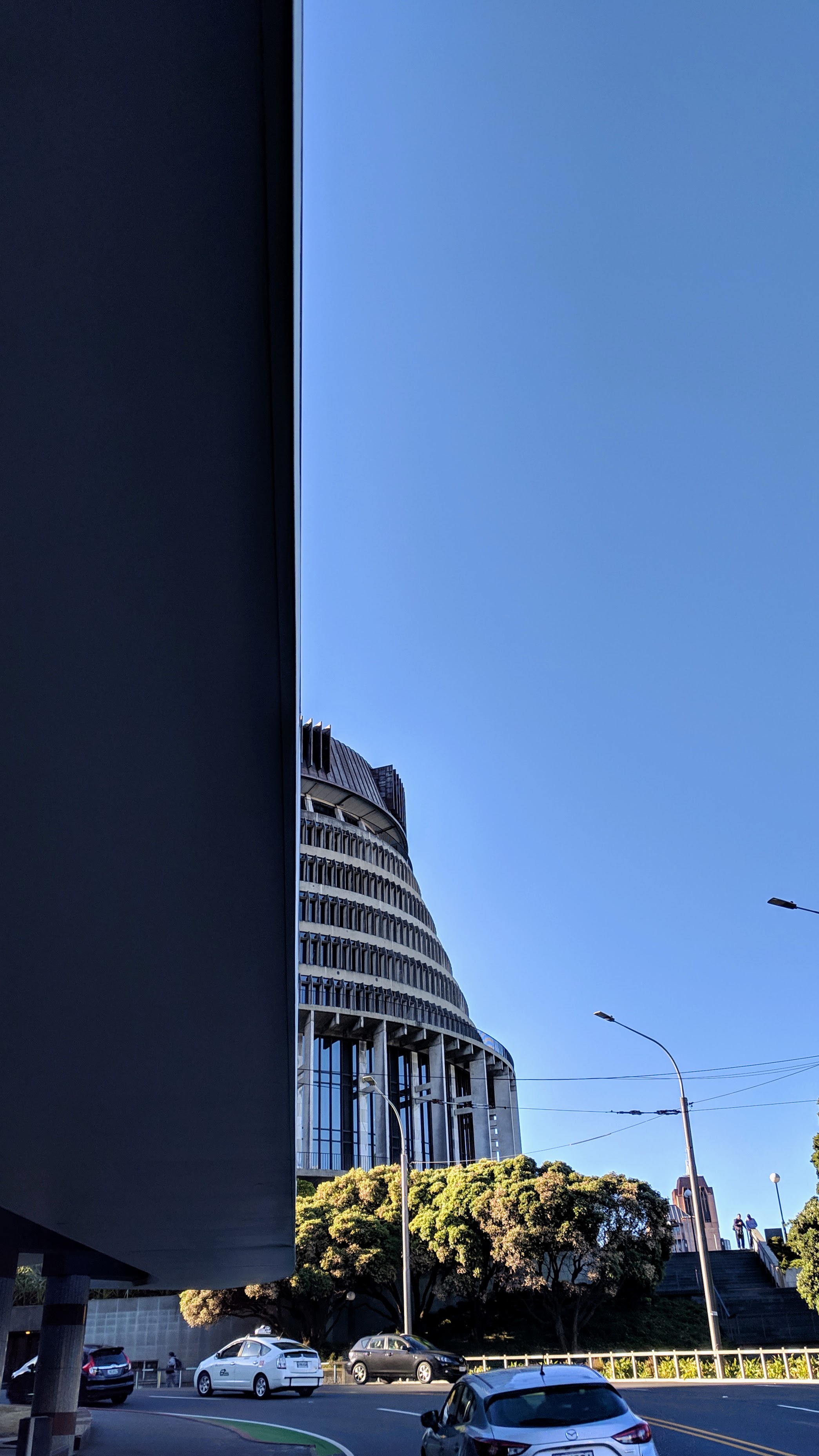 The Beehive poking out from behind another building, Wellington NZ