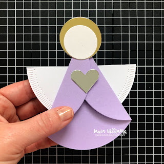 The third step of the simple angel ornament craft is to add the half circle wings onto the back of the angel's body. If you're making one angel, you can simply fold the circle in half and adhere. Or, cut it in half on your paper trimmer, and get two sets of wings from each circle! This simple craft is fun for a group to do together at Christmas time. It's kid friendly too!