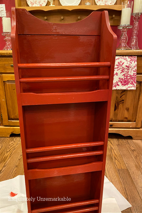Red Painted Magazine Holder DIY Makeover in process with wet paint