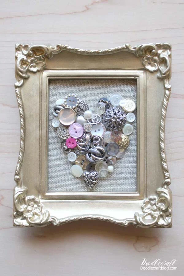 Vintage Button Heart Frame  Pull out those old vintage buttons in the cookie tin and turn them into a beautiful piece of decor for the home.   If you are like me, you have a whole host of buttons or other vintage treasures in a cookie tin somewhere that would be perfect for this homemade goodie.   Make a framed piece of art and home decor, or sew them right onto a denim jacket for gorgeous cottagecore fashion.