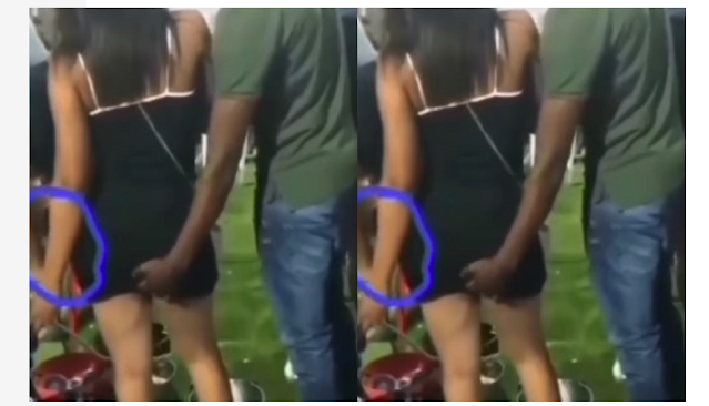 What is going here? Man seen taking his fingers to the under skirt of his bestie’s girlfriend at a public event