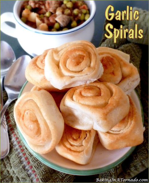 Garlic Spirals are a great accompaniment to any lunch or dinner. | recipe developed by www.BakingInATornado.com | #recipe