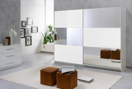 You can free up space in your bedroom by using a mirror wardrobe instead of additional mirrors.