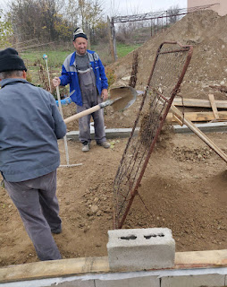 Sifting the soil through an old gate