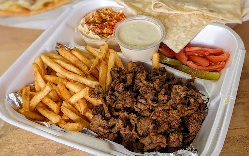Beef shawarma plate with hummus and fries
