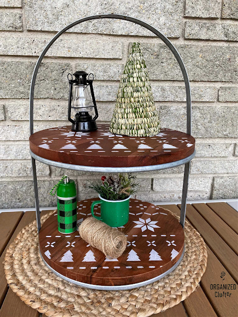 Photo of a Target Joanna Gaines Hearth & Hand Tiered Stand stenciled with a Poinsettia Christmas Sweater Stencil from Old Sign Stencils.