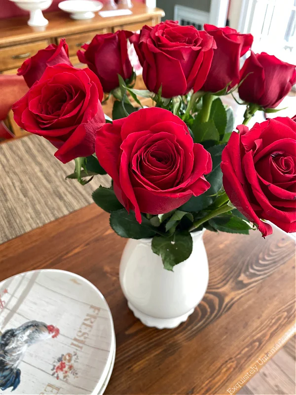 Red Roses on Table in white vase