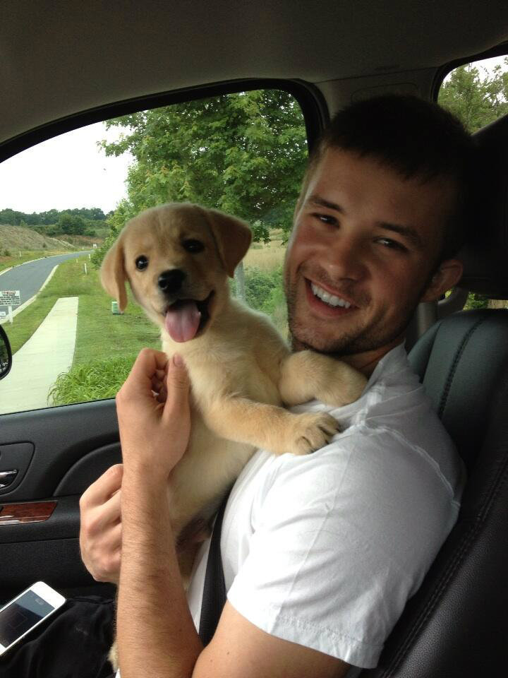cute-guys-smile-holding-dog-car
