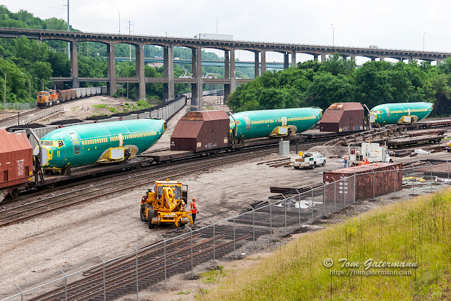 Three Boeing 737 fuselages roll north in the West Bottoms of Kansas City, MO