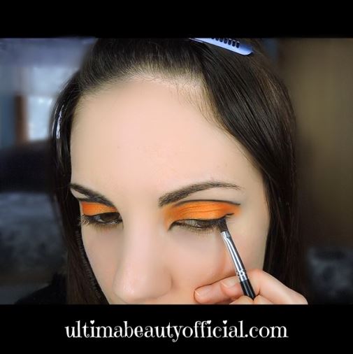 Ultima Beauty lining lash line with an angled eyeliner brush