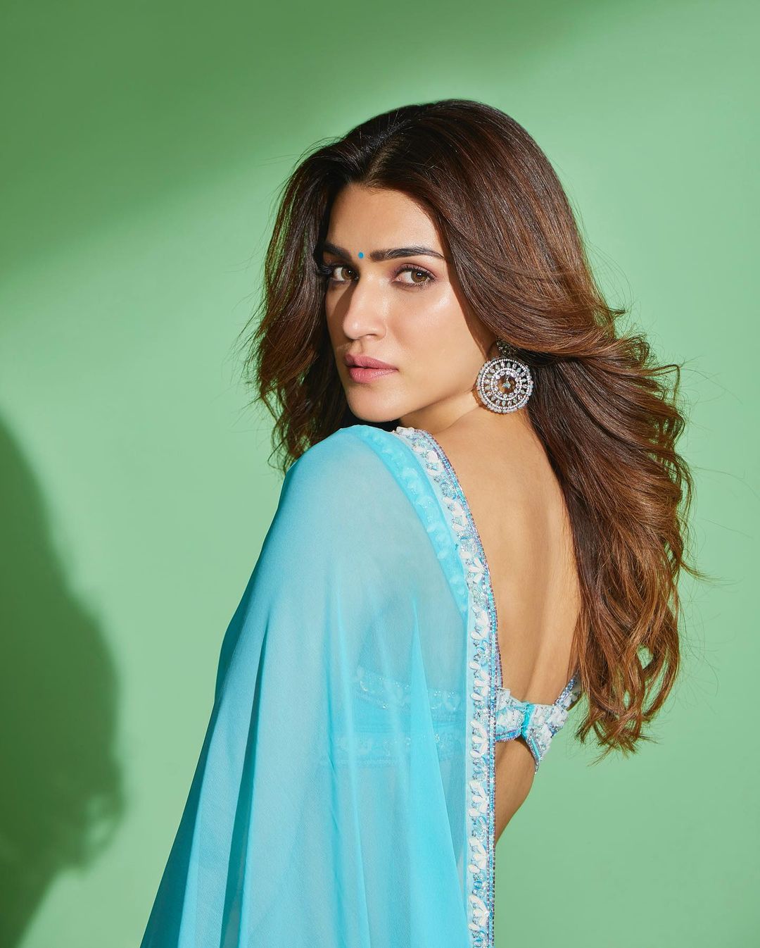 Kriti Sanon wearing a beautiful blue Georgette saree with intricate embroidery and jewelry for Bhediya Launch