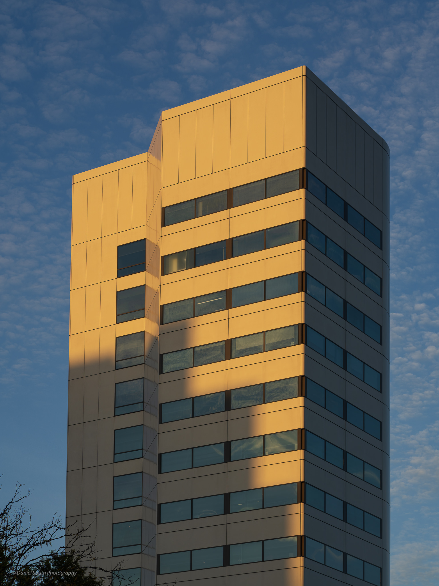 a photo of a modern office tower at sunset in new brunswick new jersey