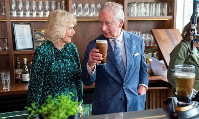 The Duchess of Cornwall wore a green silk midi dress by Samantha Cameron's label Cefinn. Irish Cultural Centre in Hammersmith